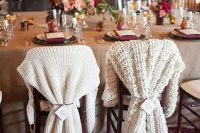 differently knit chair covers for the bride and groom instead of usual signs look very winter-like