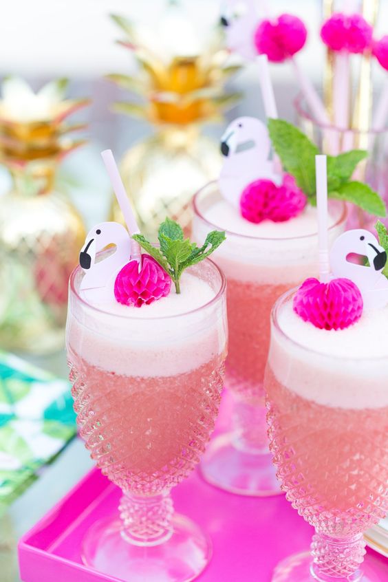 fun and glam pink cocktails with hot pink pompoms, flamingos and mint are amazing for your playful tropical or mid-century modern wedding