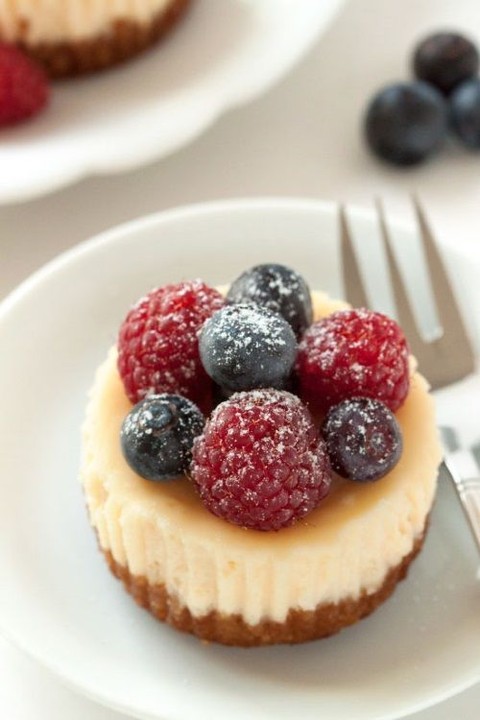 gluten-free mini cheesecakes topped with fresh berries are a perfect idea for guests who don't eat gluten