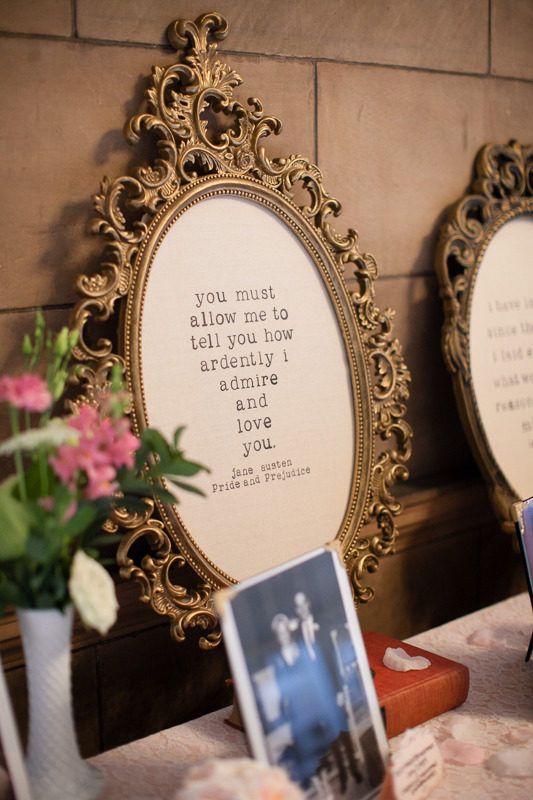 matching oval signs in ornated gold frames, with quotes are very chic and beautiful for wedding decorating