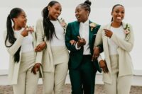 matching pale green pantsuits, white tops and brown boots are amazing for styling bridesmaids for a modern or minimalist wedding