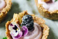 mini blackberry cheesecake tarts with walnut crust are delicious and adorable for a modern wedding