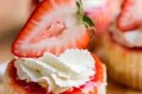 mini strawberry cheesecakes with cream and berries on top look cute, sweet and nice