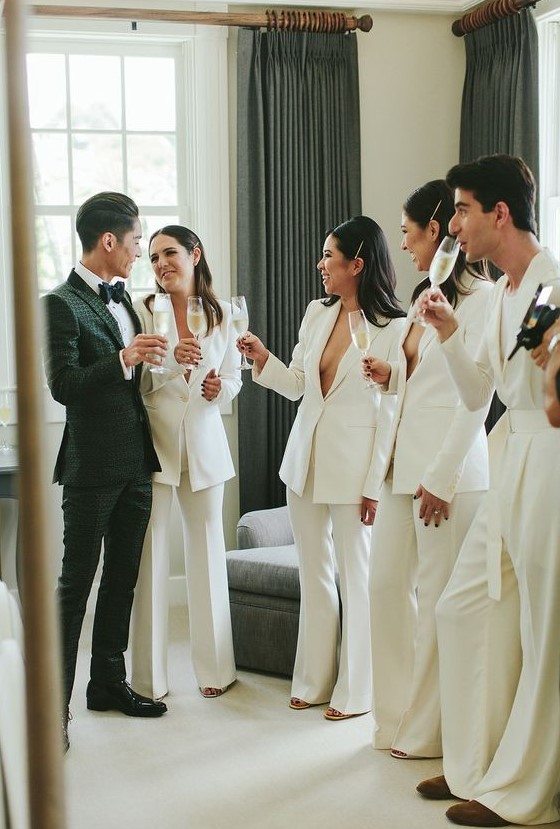 minimalist white pantsuits with no tops under for a sexy and non-traditional ridal party look