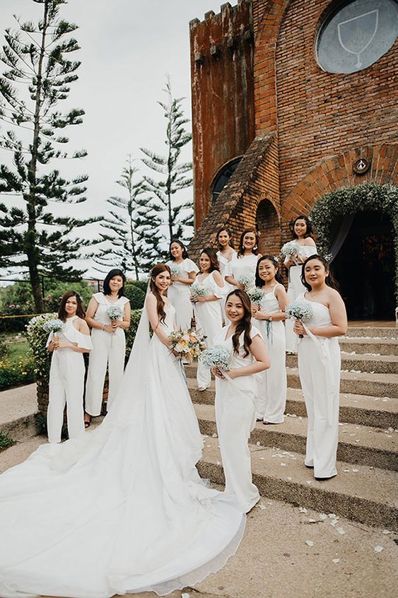 mismatching all-white bridesmaid jumpsuits are a great idea if you want a white bridal party, they look very chic and lovely