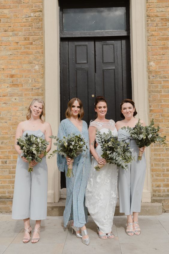 mismatching aqua-colored bridesmaid pantsuits, plain and lace ones plus silver shoes for a seaside wedding
