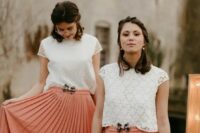 mismatching boho lace cap sleeve crop tops and peachy pink plated midi skirts with pretty bows for a boho wedding
