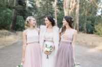mismatching bridesmaid ensembles with white and nude lace up crop tops, a dusty pink and a pink tulle midi skirt for a boho wedding