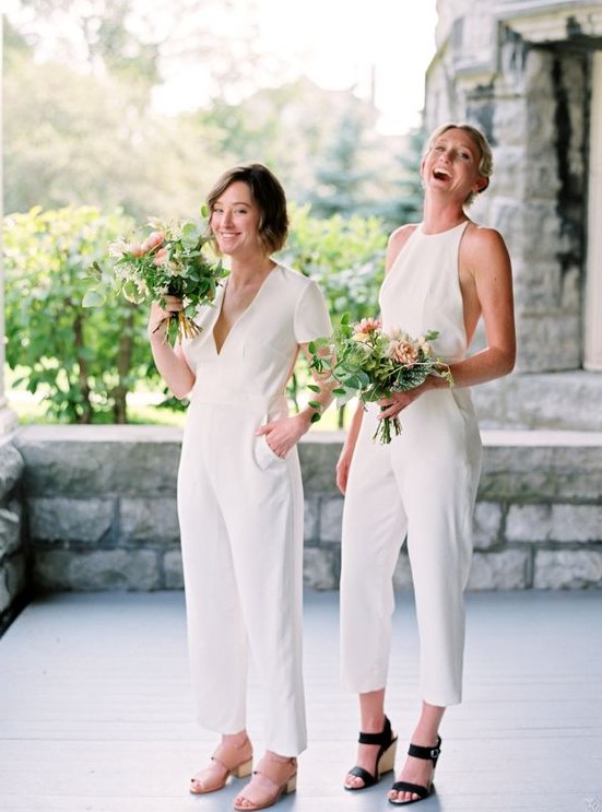 mismatching white bridesmaid jumpsuits with pockets and various shoes
