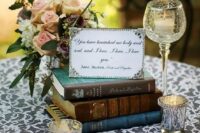 place a stack of classic love stories on each table, with a framed quote on top