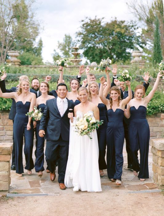 strapless black jumpsuits with wideleg pants are a very elegant and modern solution for a bridal party