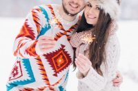 tan pants and a bold printed sweater for a casual outdoor winter wedding – this sweater will make you stand out in the snow