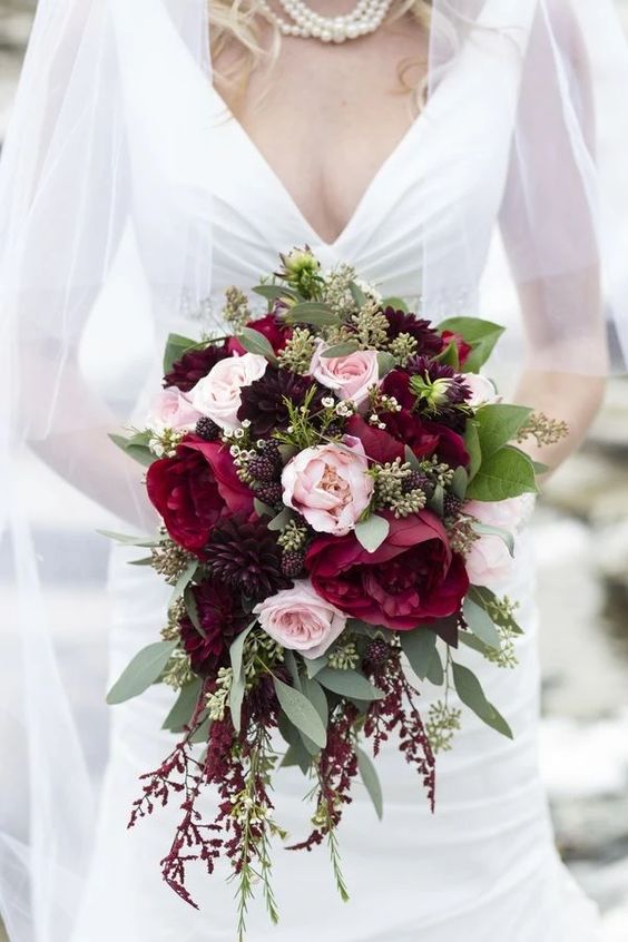 a beautiful and textural wedding bouquet with marsala and blush blooms, greenery, blackberries is a beautiful idea for a summer bride