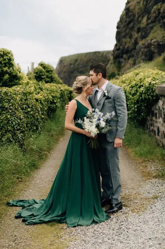 a beautiful green A-line wedding dress with thick straps, a deep V-neckline, a pleated skirt with a train is a gorgeous idea to rock