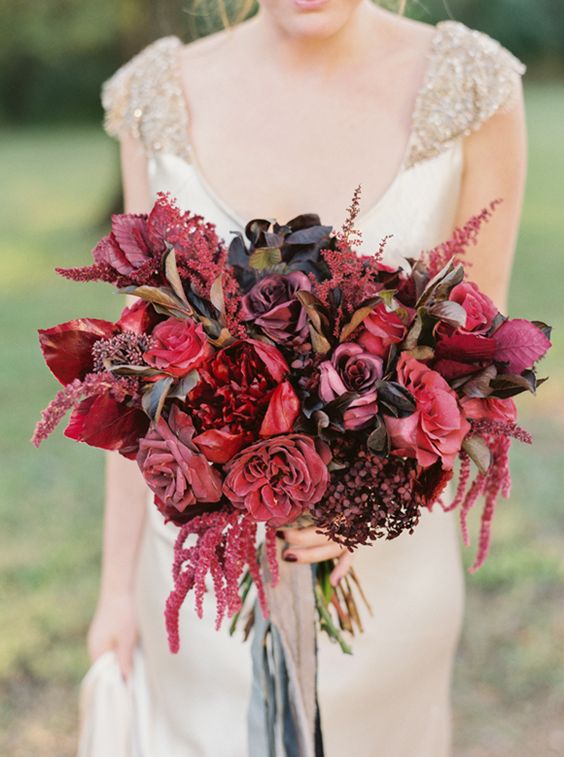 a bright fall wedding bouquet with black, marsala and red blooms, twigs, branches and neutral ribbons is a fantastic idea