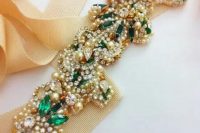 a gorgeous embellished bridal sash with pearls, rhinestones and emeralds looks wow and will add a touch of shine to your look