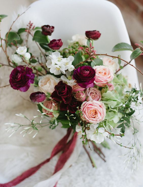 a gorgeous fall wedding bouquet of marsala, blush, white blooms, greenery and twigs is a lovely idea to rock