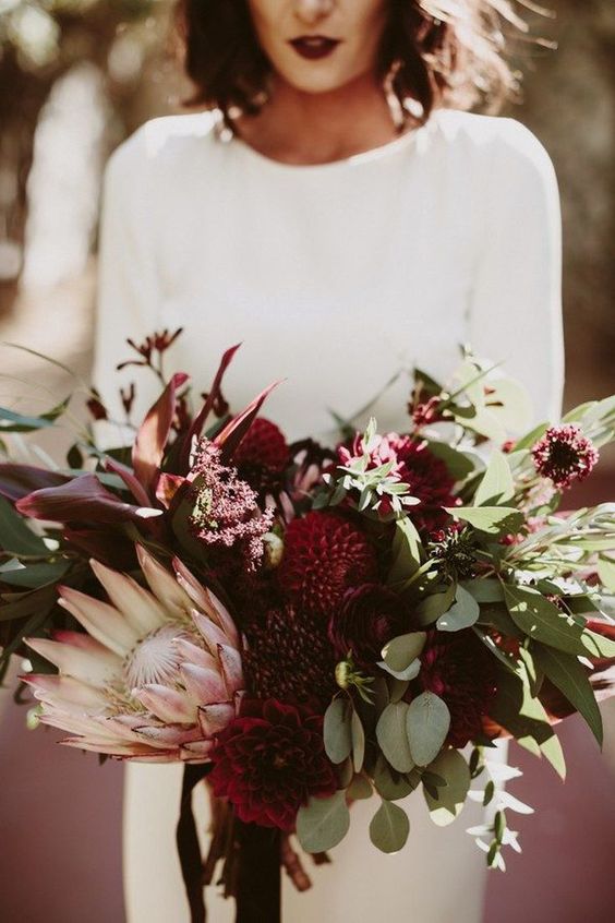 a luxurious wedding bouquet of marsala and blush blooms and lots of greenery is a lovely idea for a fall bride