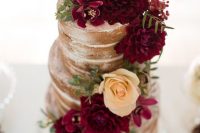 a naked wedding cake topped with marsala and neutral blooms and greenery will fit a summer or a fall wedding easily