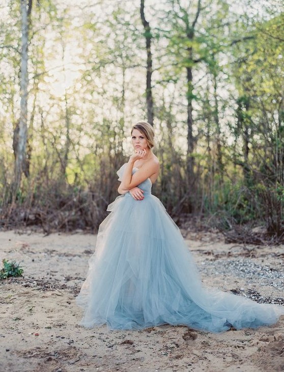 a strapless blue wedding ballgown with a draped bodice and a layered skirt with a train for your 'something blue'