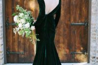 an emerald velvet wedding dress with a low back and copper hair to leave an impression
