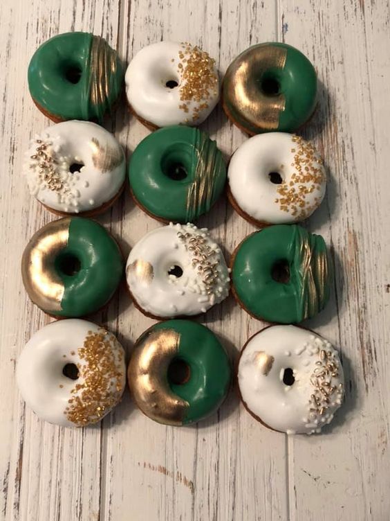 delicious emerald, gold leaf and gold glitter and white wedding donuts are a fantastic alternative to a usual wedding cake
