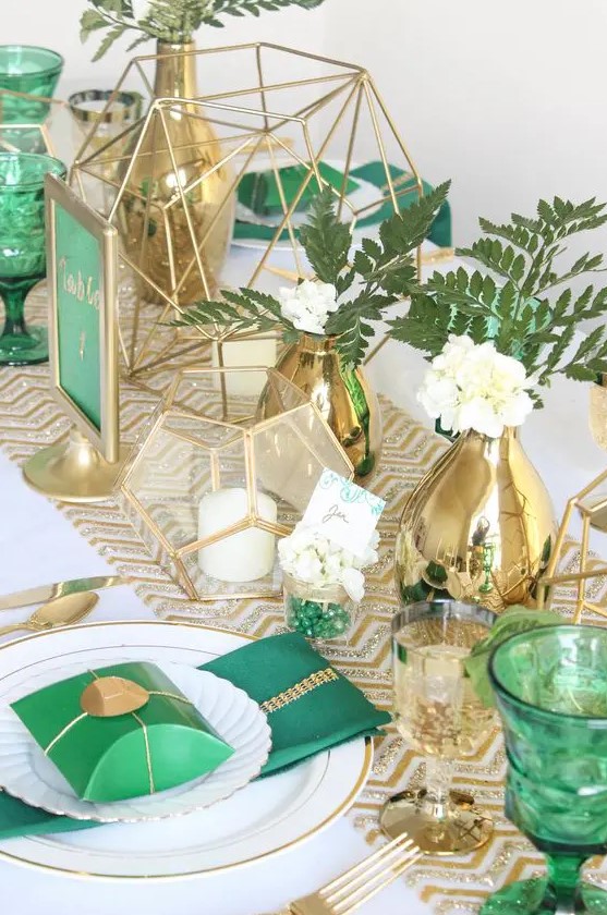 emerald glasses, napkins, table numbers and gold vases, chevron table runners and candle holders for a bold look