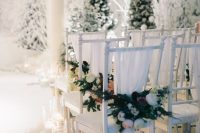 faux snow and snowballs, candles in tall candleholders for creating a winter wonderland feel in the ceremony space