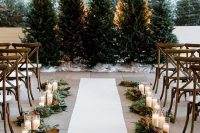 greenery and magnolia leaves garlands plus pillar candles will create really a festive feel in the ceremony space