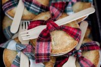 home pies with plaid ribbons and wooden forks are cool wedding favors or camp wedding desserts