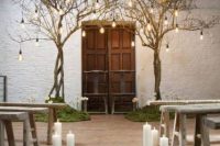 pillar candles on the floor and in glass candleholders make the wedding ceremony space wonderland-like and very romantic