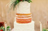 a Valentine wedding cake with a naked and buttercream tiers, greenery and white and red blooms