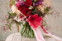 a beautiful and bold Valentine wedding bouquet of deep red, white, pink and lilac blooms and greenery plus long stripes