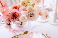 a beautiful ombre floral wedding centerpiece of pink, blush and white blooms with a pretty shape is great for Valentine’s Day