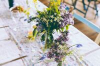 a colorful floral table runner paired with wildflowers are a great combo for a modern colorful wedding