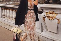 a floral embroidered midi dress, an oversized black tux, black shoes and a sheer bucket bag with blooms