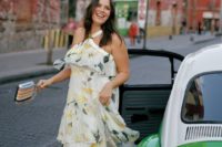 a floral print ruffle midi dress with a loop for your neck, silver shoes and a striped clutch