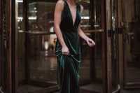 a green velvet maxi dress with no sleeves and a plunging neckline is a refined and chic look that never goes out of style