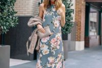 a grey floral print maxi dress with a halter neckline, grey clutch and a grey suede jacket for a spring guest