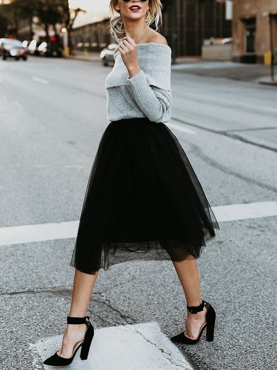 a grey off the shoulder sweater, a black tulle skirt, black block heels for a girlish feel