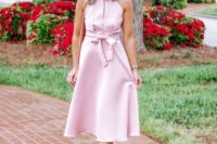 a light pink halter neckline midi dress, a bow, blush shoes and a bag for a cute and romantic outfit