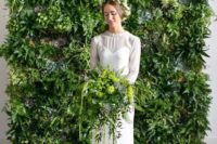 a living wall backdrop and a matching bridal bouquet to bring an outdoor feel indoors