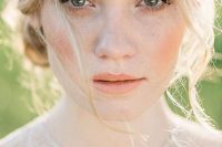 a lovely peachy wedding makeup with a peachy blush and lip, with a touch of peachy eyeshadow and accented skin