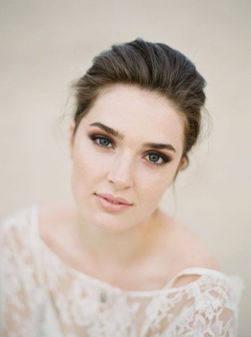 a lovely spring wedding makeup with brown smokeys, a pink lip, a touch of blush and accented eyebrows