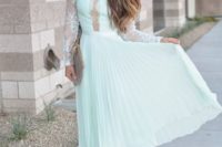 a mint midi dress with a lace bodice, a pleated skirt and long sleeves, nude shoes