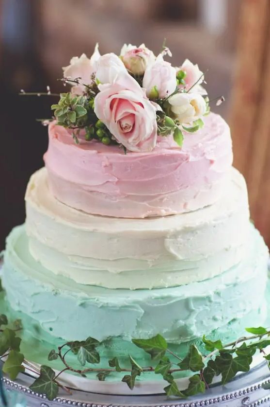 a pastel textural wedding cake with mint and pink tiers and fresh blooms on top is amazing for a spring wedding