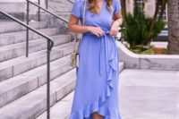 a purple wrap midi dress with a ruffled edge, short sleeves, nude shoes and a white bag is sexy and comfy