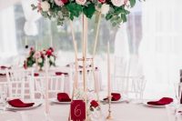 a refined floral wedding centerpiece of blush, white, lilac and red blooms and foliage and eucalyptus for Valentine’s Day