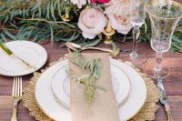a stunning Valentine’s Day wedding table with a greenery runner, a bold pink, lavender and blush floral arrangement, gold cutlery and a charger
