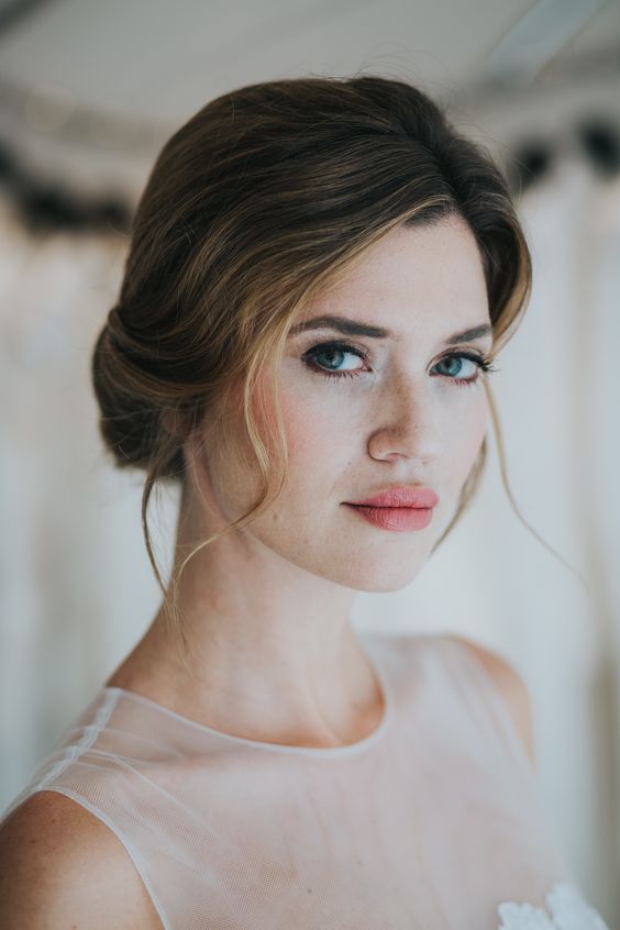 a super fresh and bold wedding makeup with a bright pink lip, a touch of blush, accented eyes with mascara and eyeliner, beautiful skin tone